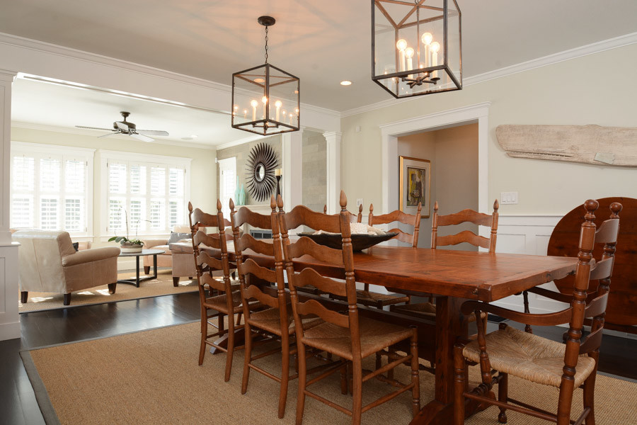 Example of a mid-sized transitional dark wood floor great room design in Boston with beige walls and no fireplace