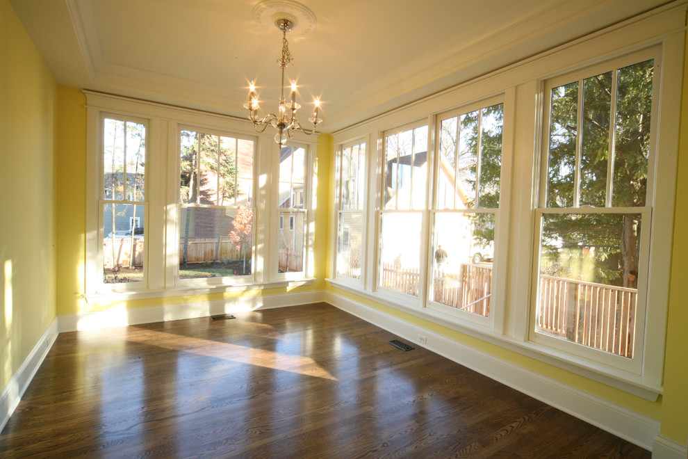 Inspiration for a medium sized classic enclosed dining room in Chicago with yellow walls and dark hardwood flooring.