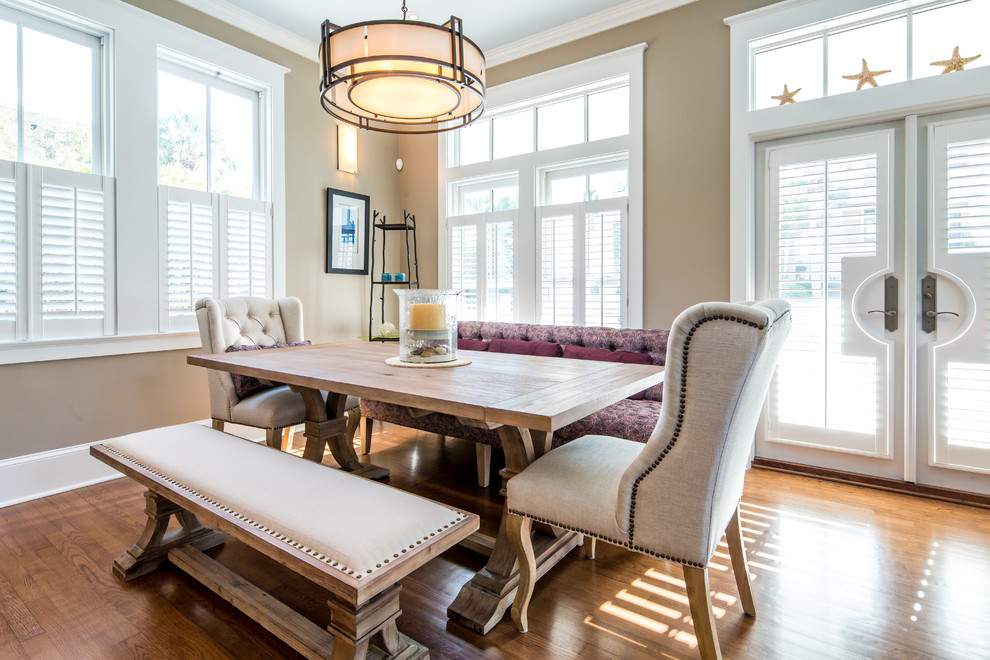 Medium sized coastal kitchen/dining room in Miami with medium hardwood flooring, no fireplace and beige walls.