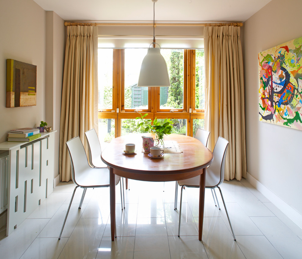 Inspiration for a contemporary dining room in Dublin with beige walls.