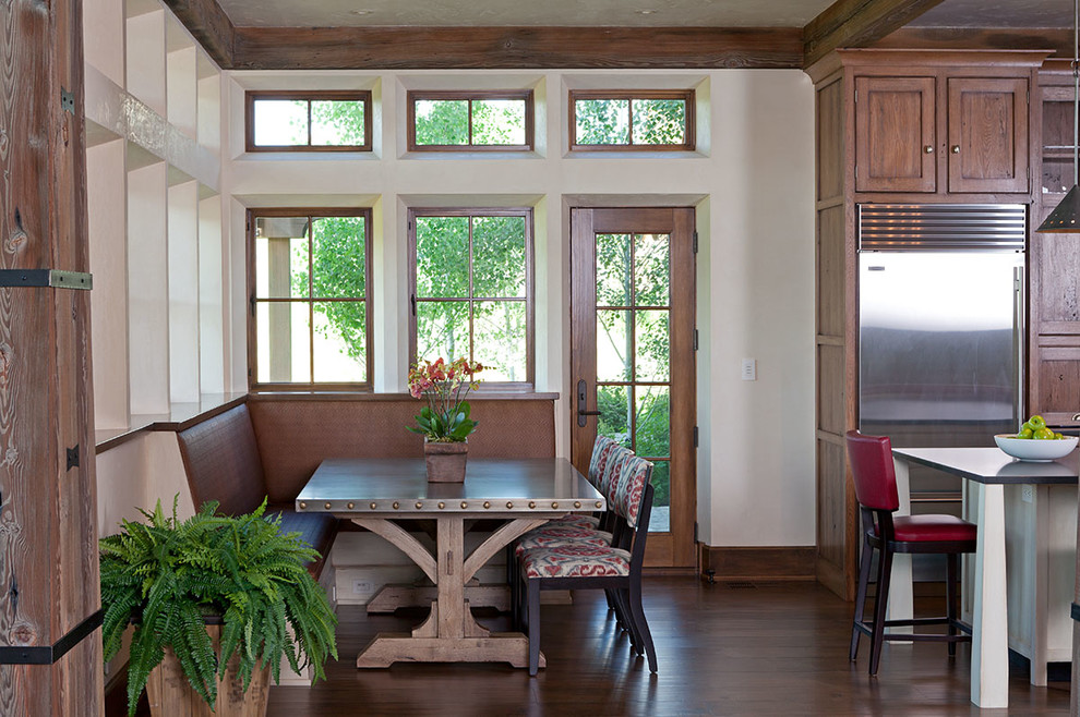 Inspiration for a mid-sized transitional dark wood floor kitchen/dining room combo remodel in Other with white walls and no fireplace