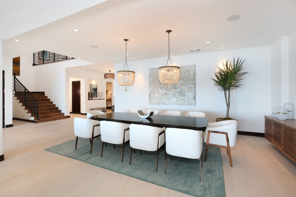 Photo of a large contemporary dining room in Orange County with white walls and no fireplace.