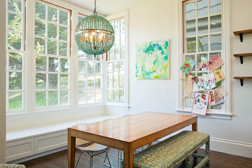 This is an example of a traditional dining room in Jacksonville with white walls.