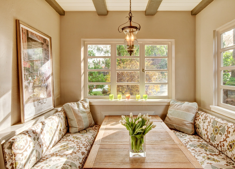 Dining room - mediterranean dining room idea in Seattle with beige walls