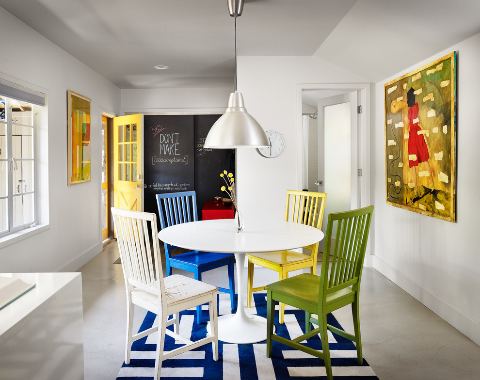 Inspiration for a contemporary concrete floor and gray floor dining room remodel in Austin