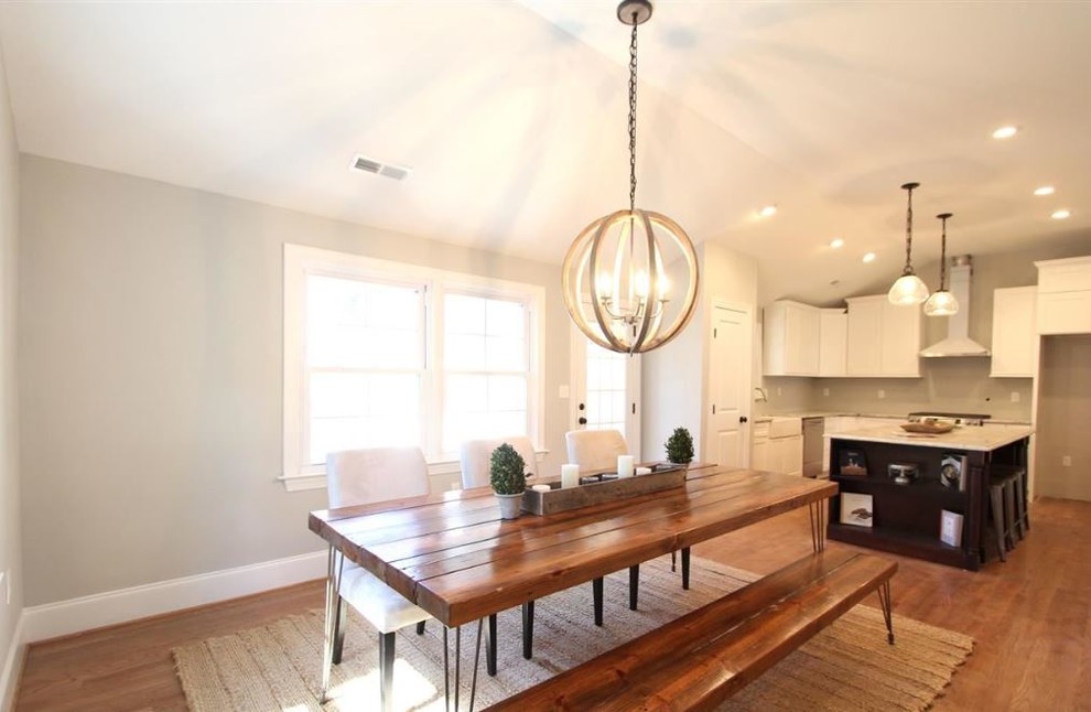Inspiration for a large contemporary open plan dining room in Raleigh with grey walls and medium hardwood flooring.