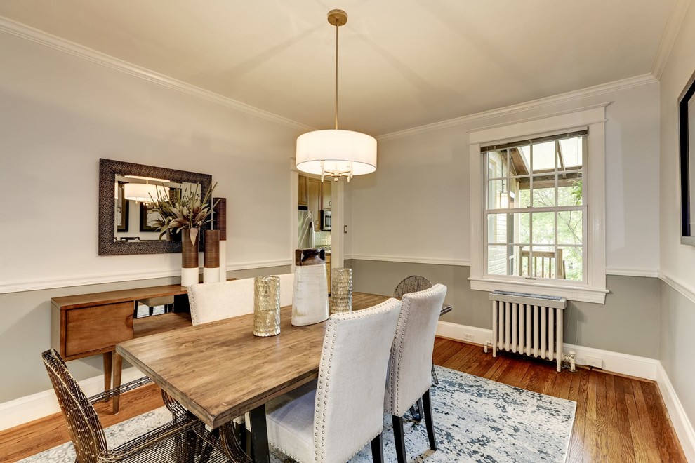 This is an example of a medium sized contemporary enclosed dining room in DC Metro with grey walls, light hardwood flooring, no fireplace and beige floors.