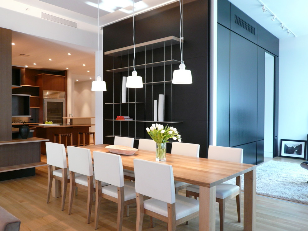 This is an example of a contemporary open plan dining room in New York.