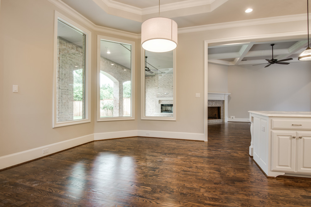 Inspiration for a traditional kitchen/dining room in Dallas with grey walls and medium hardwood flooring.