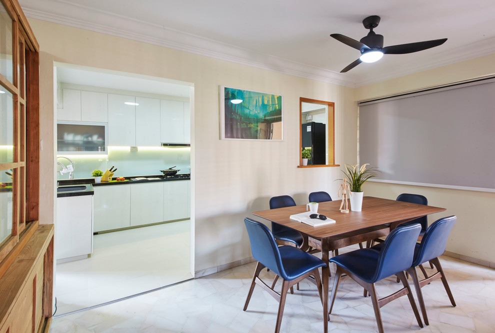 This is an example of a medium sized contemporary kitchen/dining room in Singapore with beige walls and porcelain flooring.
