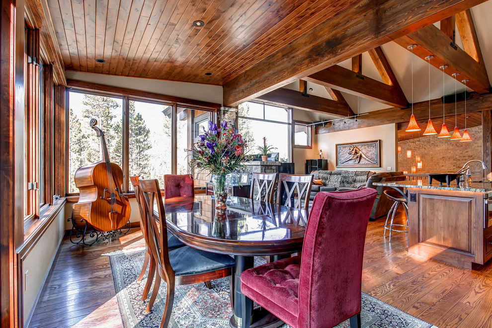 Inspiration for a timeless dark wood floor great room remodel in Denver with white walls