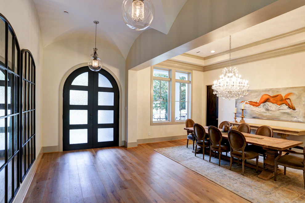 This is an example of a contemporary dining room in Houston.
