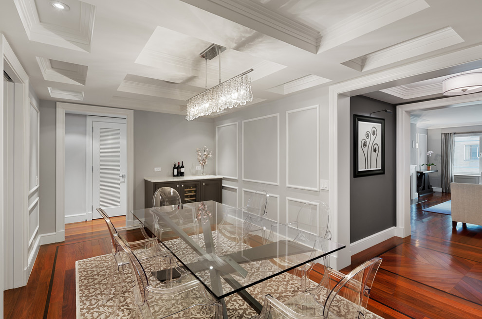 Enclosed dining room - mid-sized transitional dark wood floor enclosed dining room idea in New York with gray walls and no fireplace