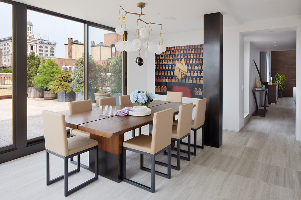 This is an example of a contemporary dining room in New York with white walls and no fireplace.