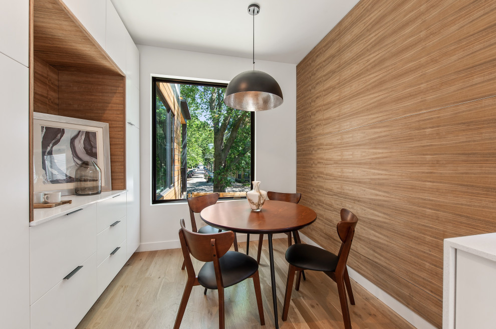 Example of a trendy light wood floor dining room design in Chicago