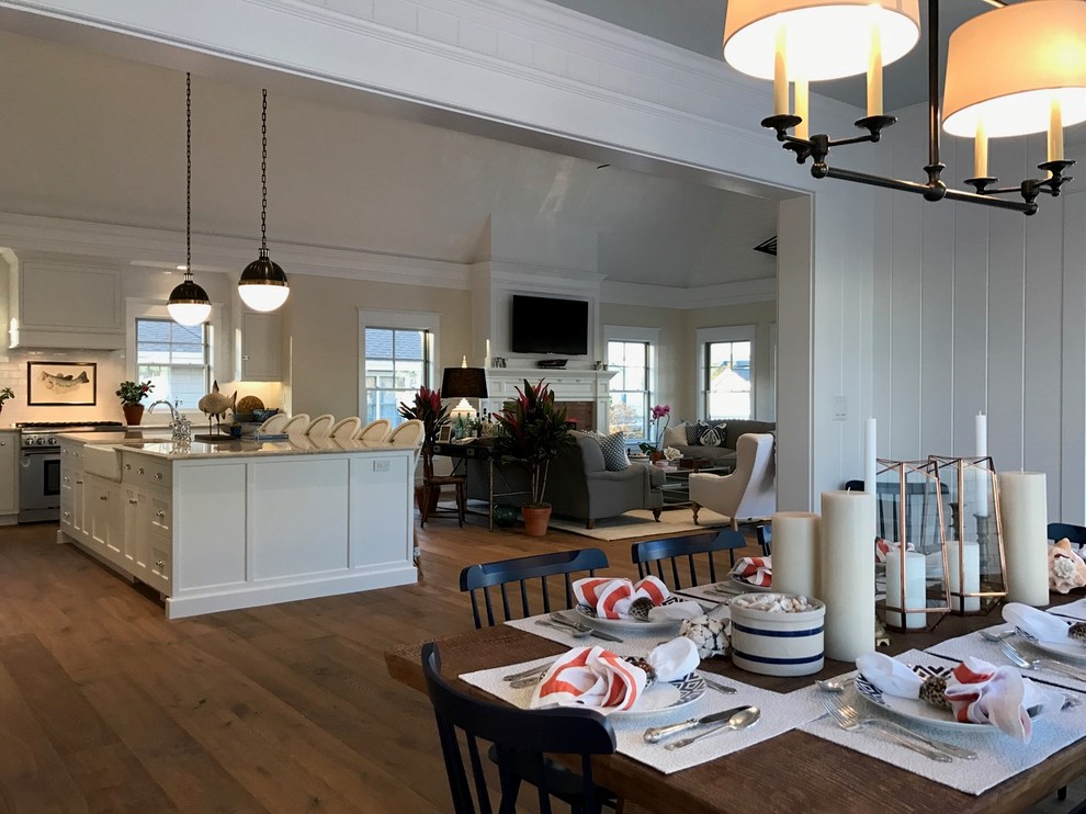This is an example of a beach style kitchen/dining room in Philadelphia with white walls and medium hardwood flooring.
