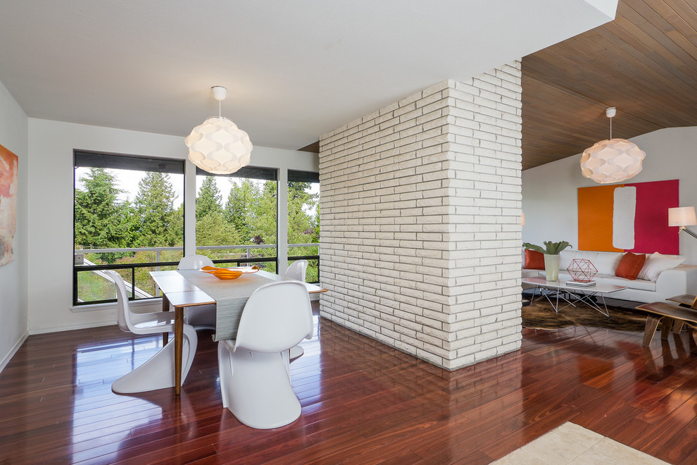 Photo of a modern dining room in Seattle with white walls.
