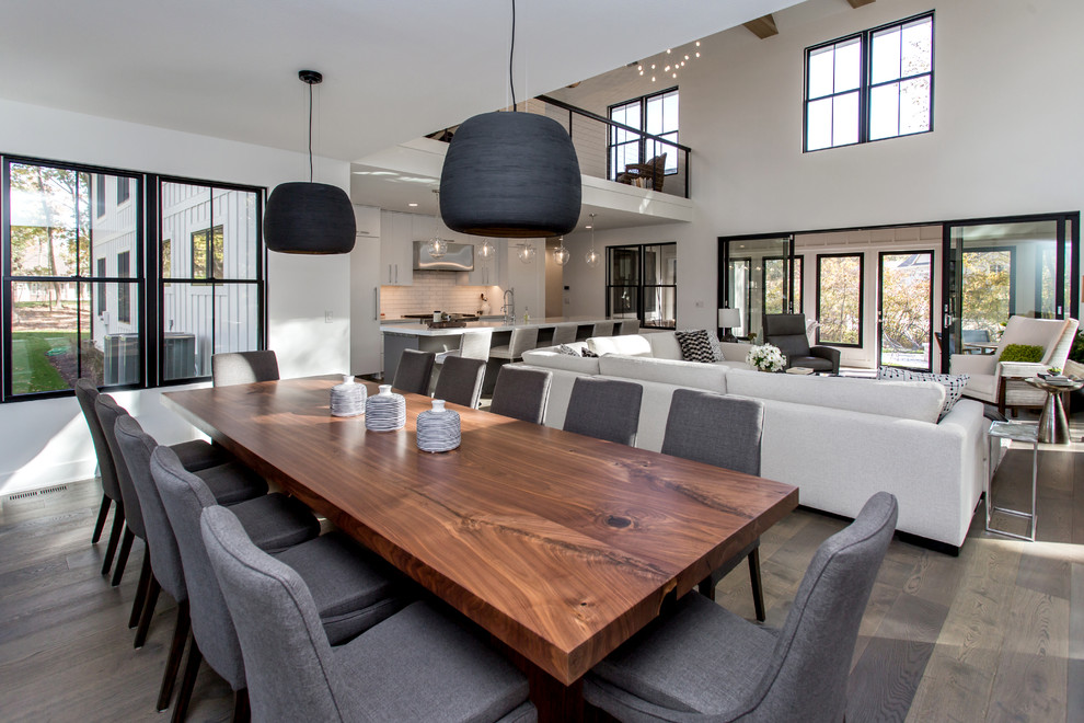Inspiration for a large contemporary open plan dining room in Other with white walls, dark hardwood flooring, no fireplace and brown floors.