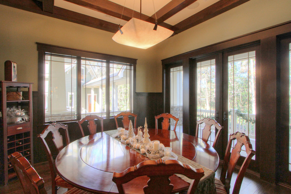 Example of an arts and crafts dark wood floor dining room design in Atlanta