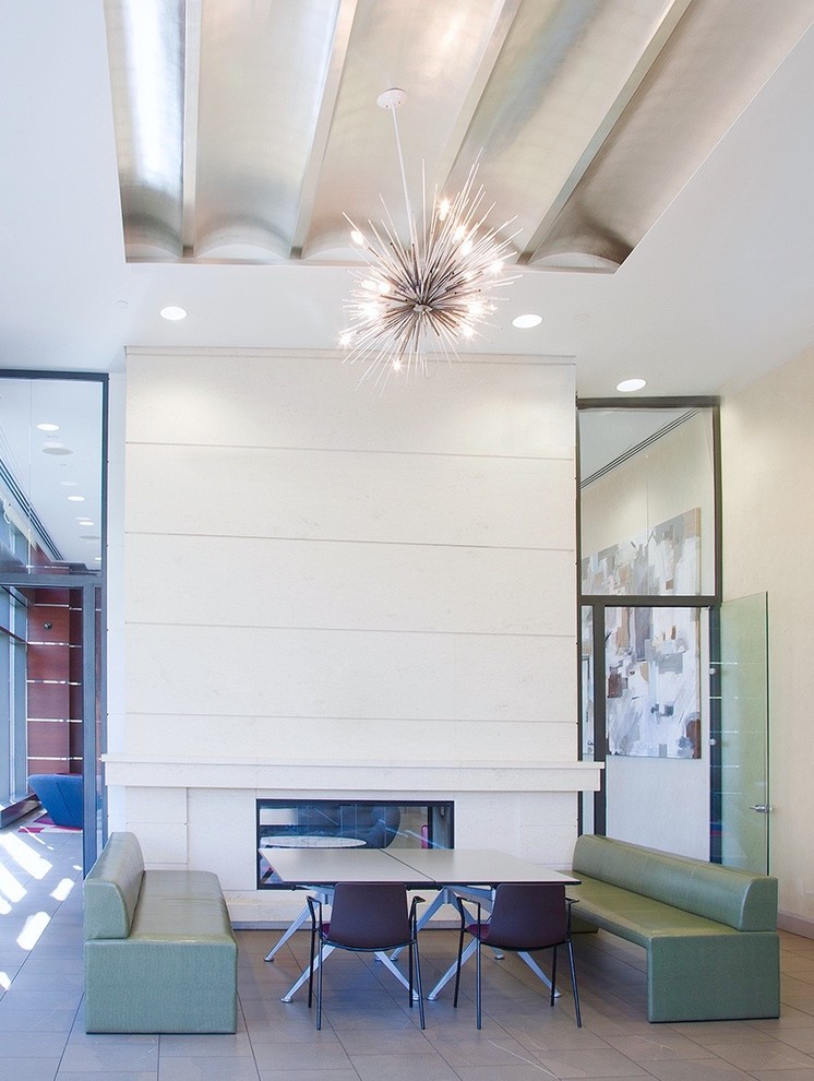 Large contemporary open plan dining room in New York with white walls, ceramic flooring and no fireplace.