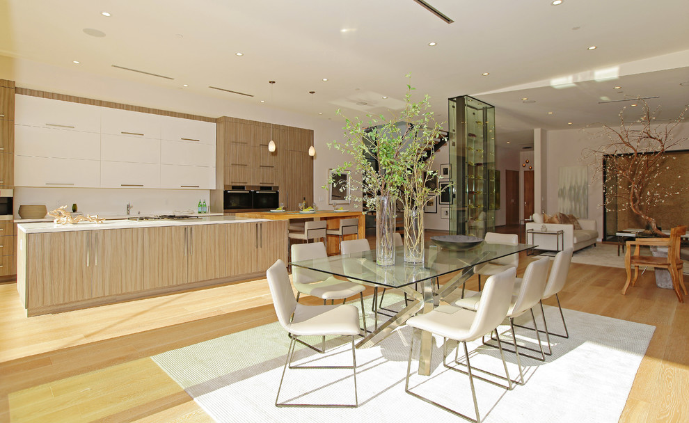 This is an example of a contemporary open plan dining room in Los Angeles.
