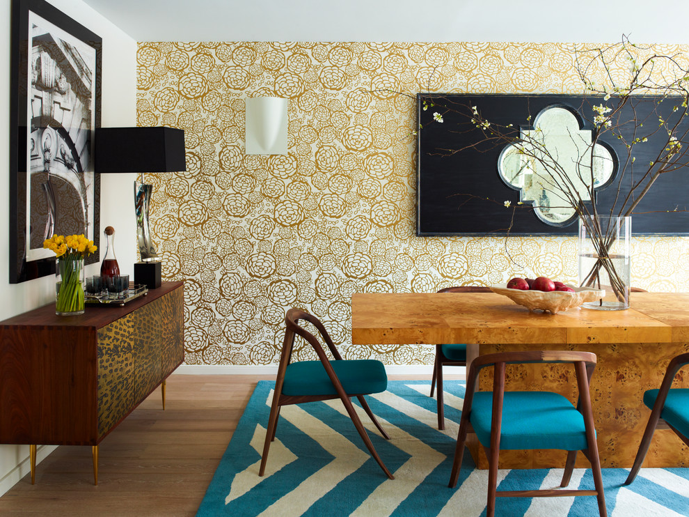 Inspiration for a contemporary medium tone wood floor dining room remodel in New York with white walls