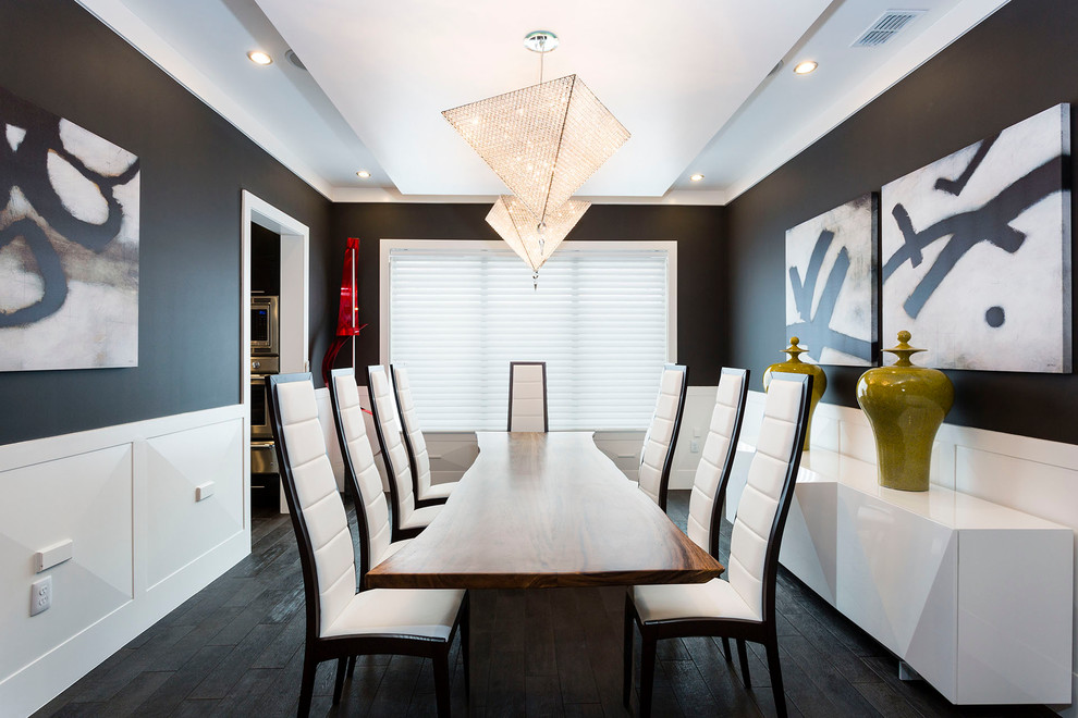Design ideas for a contemporary enclosed dining room in Orlando with black walls, dark hardwood flooring and black floors.