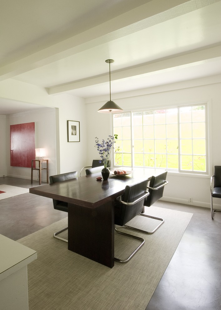 Esempio di una sala da pranzo aperta verso il soggiorno minimalista