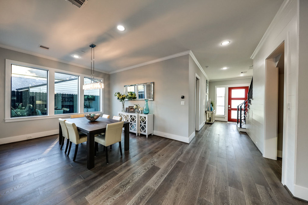 Great room - mid-sized transitional vinyl floor great room idea in Houston with gray walls and no fireplace