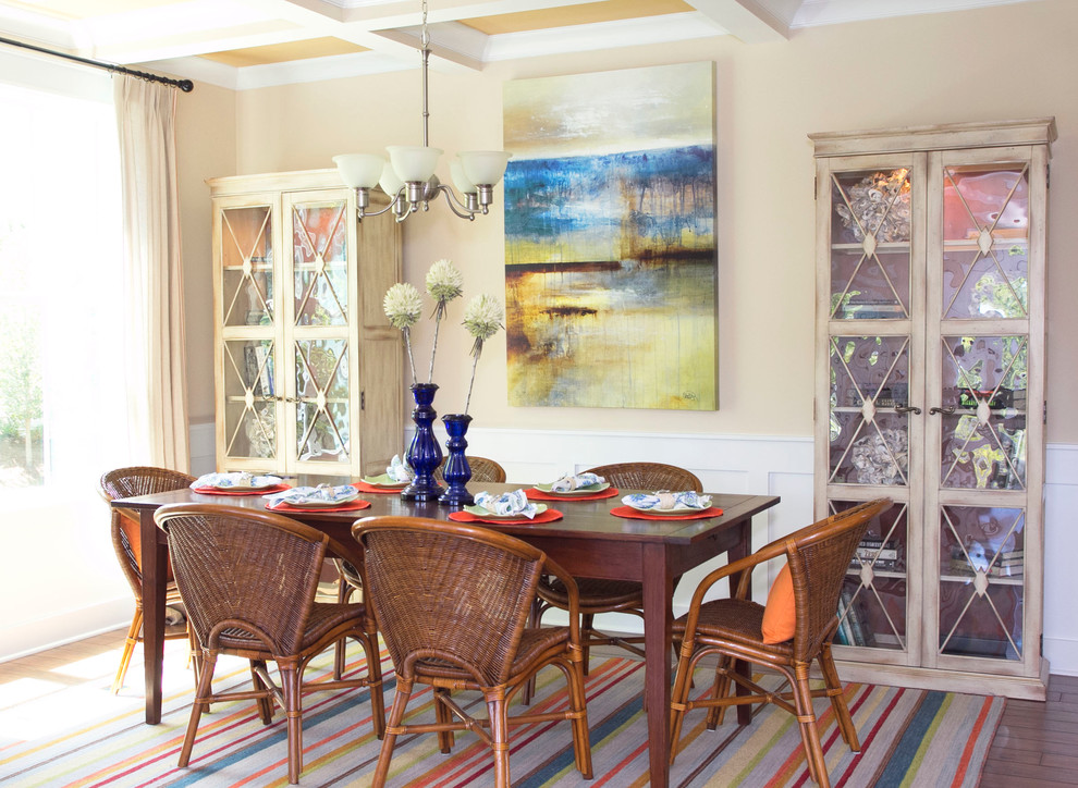 This is an example of a beach style dining room in Atlanta with beige walls and dark hardwood flooring.