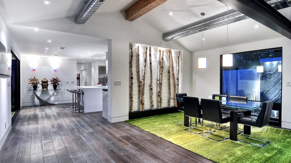 Enclosed dining room - large modern bamboo floor and brown floor enclosed dining room idea in Orange County with white walls