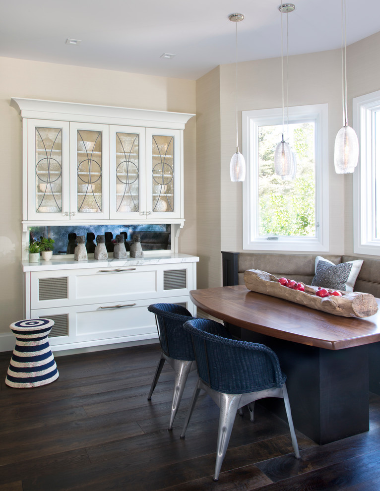 Classic dining room in Denver with beige walls and dark hardwood flooring.