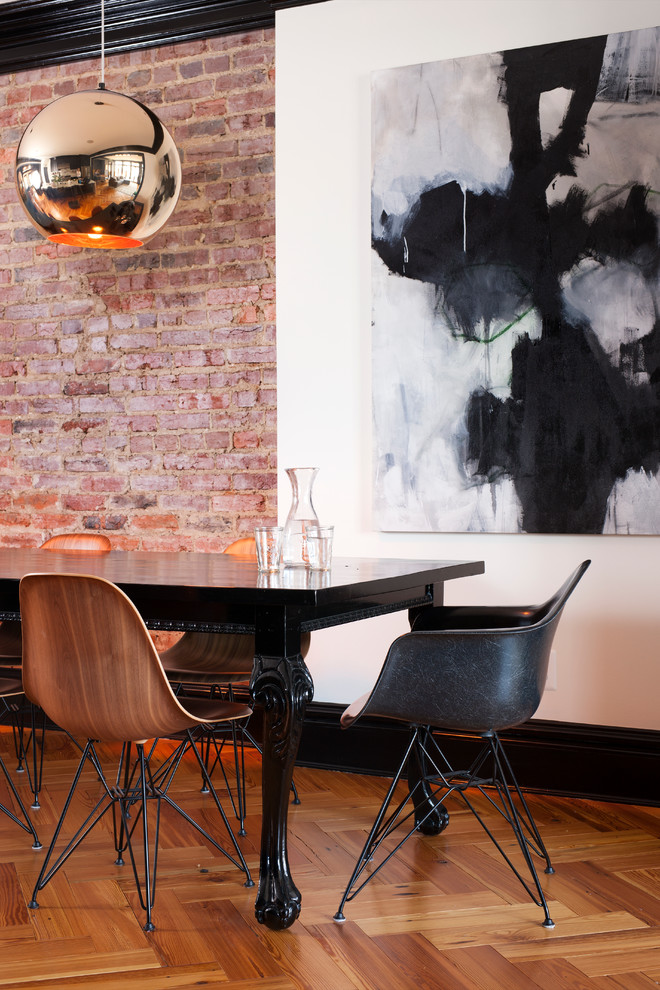 This is an example of a medium sized bohemian kitchen/dining room in DC Metro with white walls, light hardwood flooring and no fireplace.