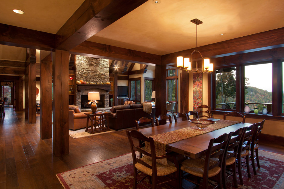 Inspiration for a traditional open plan dining room in Other with dark hardwood flooring and feature lighting.