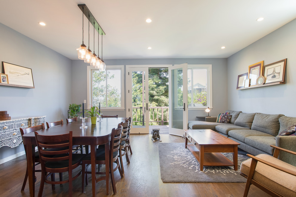 Large transitional medium tone wood floor and brown floor kitchen/dining room combo photo in San Francisco with gray walls