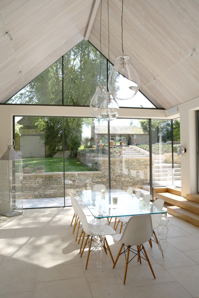 Design ideas for a medium sized contemporary dining room in Gloucestershire with beige floors.