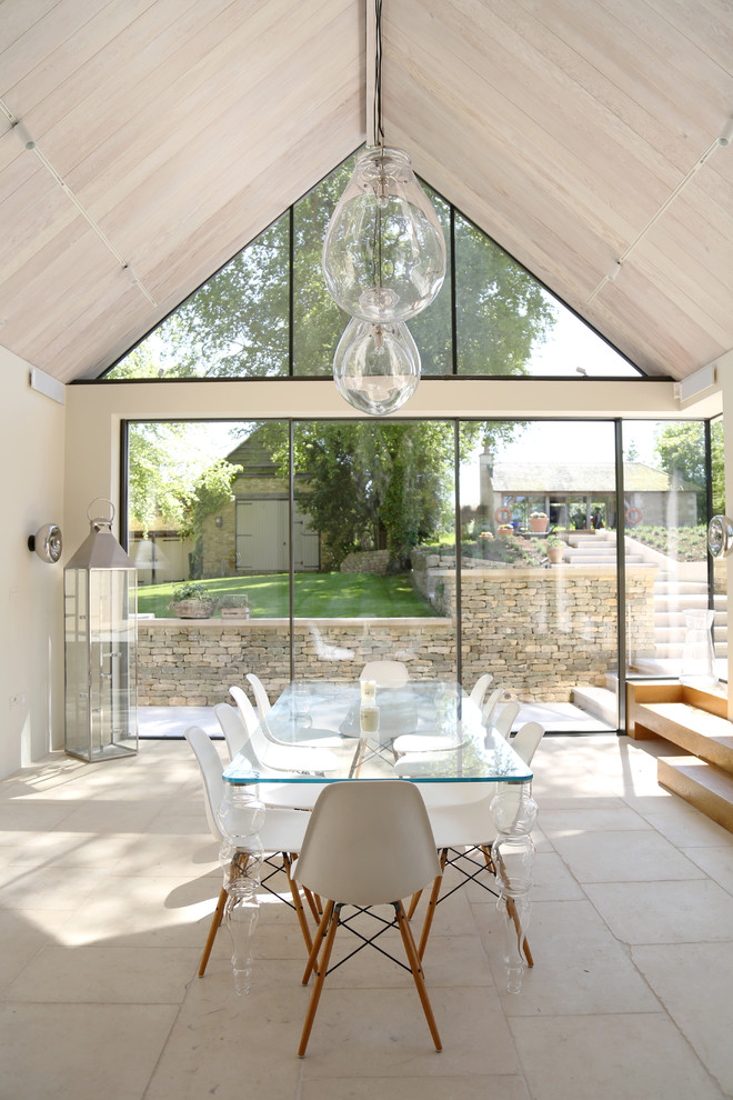 Inspiration for a medium sized contemporary dining room in Gloucestershire with beige floors and beige walls.