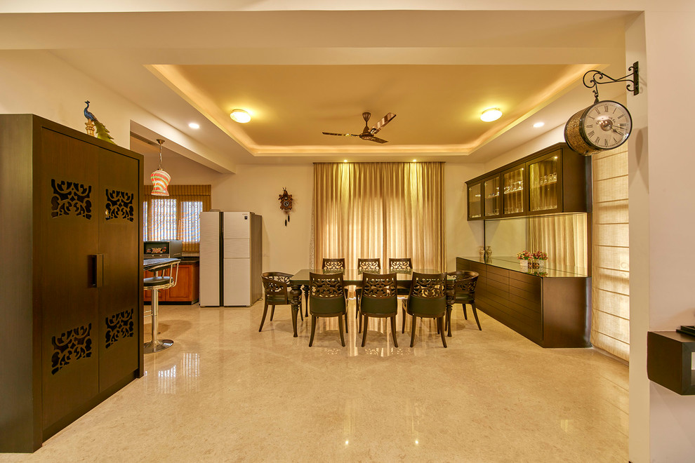 Design ideas for a contemporary dining room in Bengaluru.