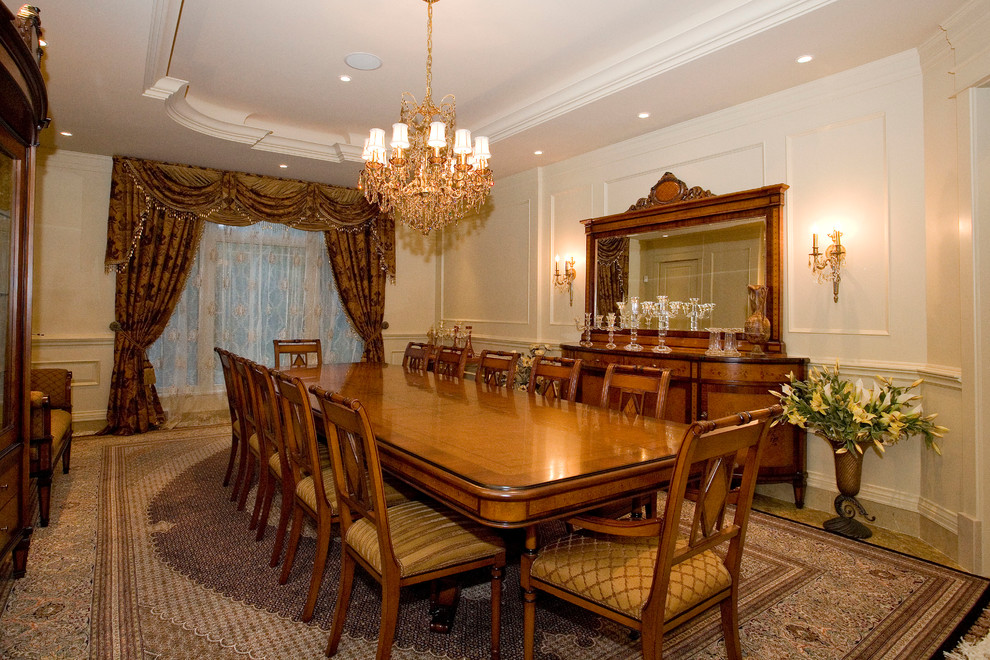 Huge tuscan carpeted enclosed dining room photo in Other with no fireplace and white walls