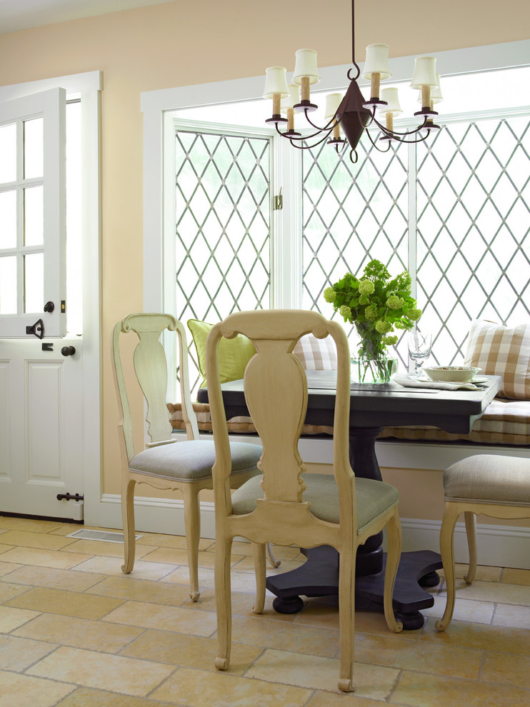 Example of a mid-sized cottage dark wood floor dining room design in New York with beige walls