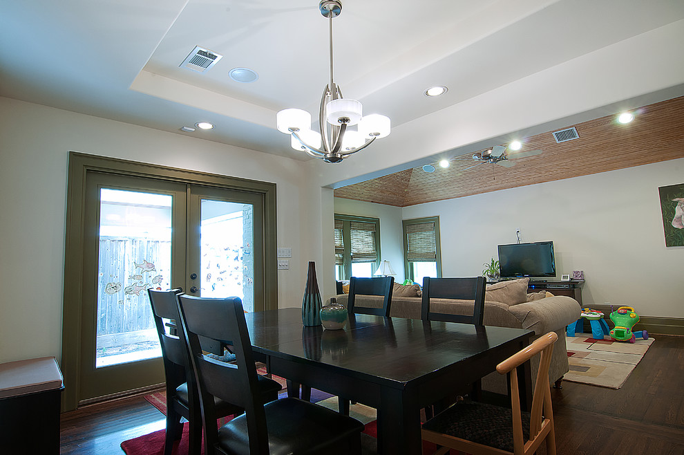 This is an example of a contemporary dining room in Houston.