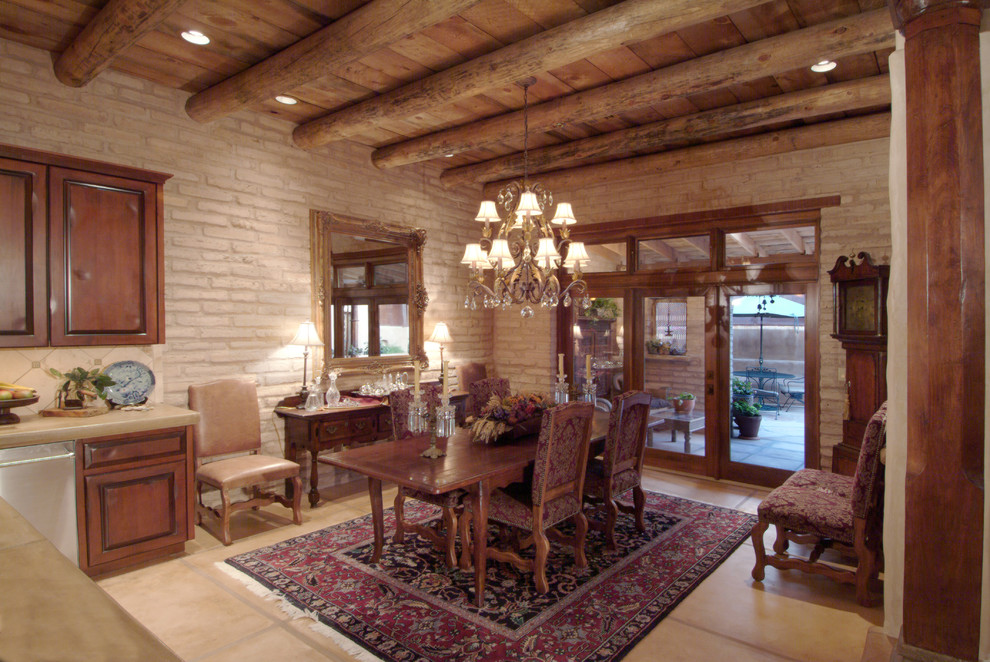 This is an example of a medium sized rustic kitchen/dining room in Phoenix with concrete flooring, beige walls, no fireplace and beige floors.