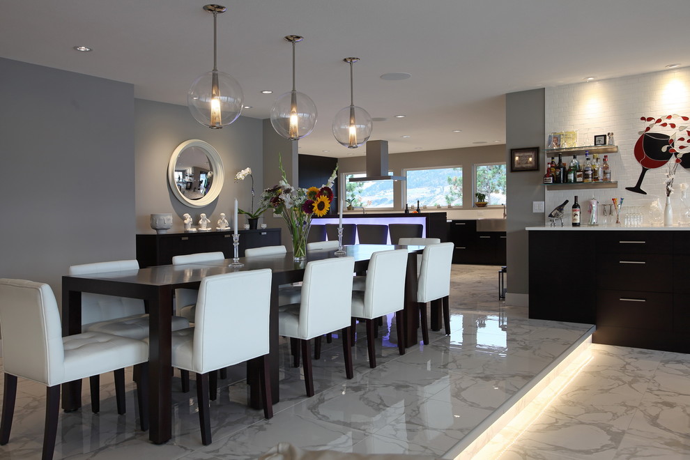 Photo of a large modern open plan dining room in Vancouver with grey walls and marble flooring.