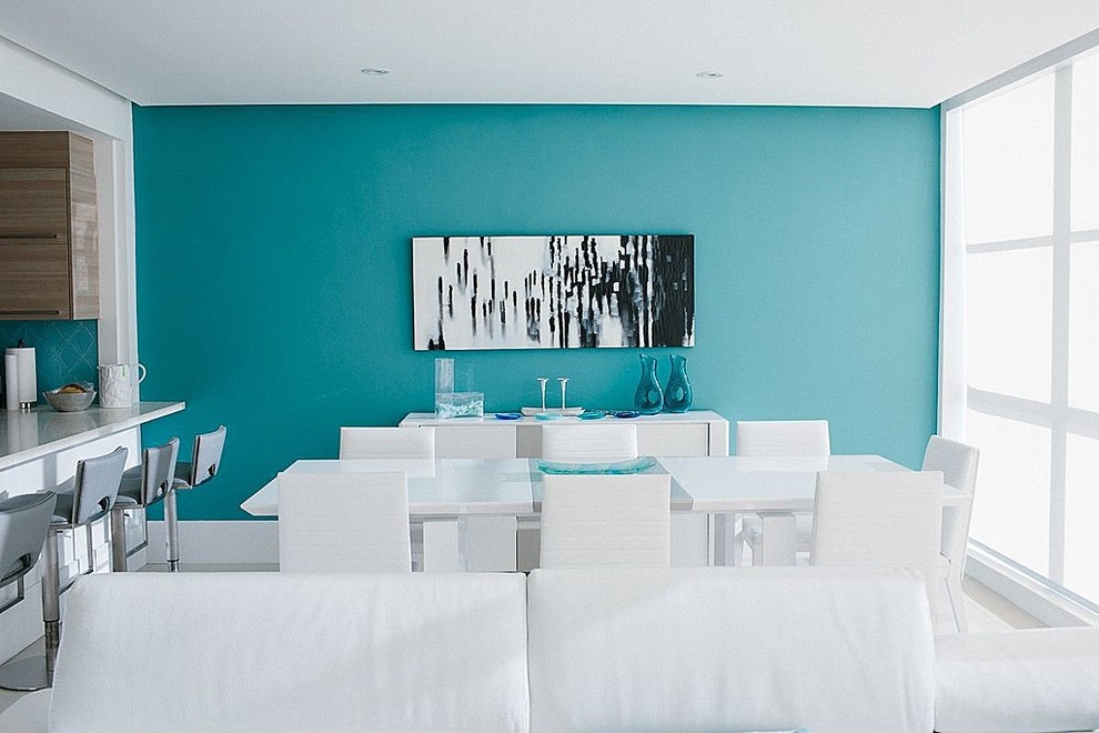 Beach style dining room photo in Miami with blue walls