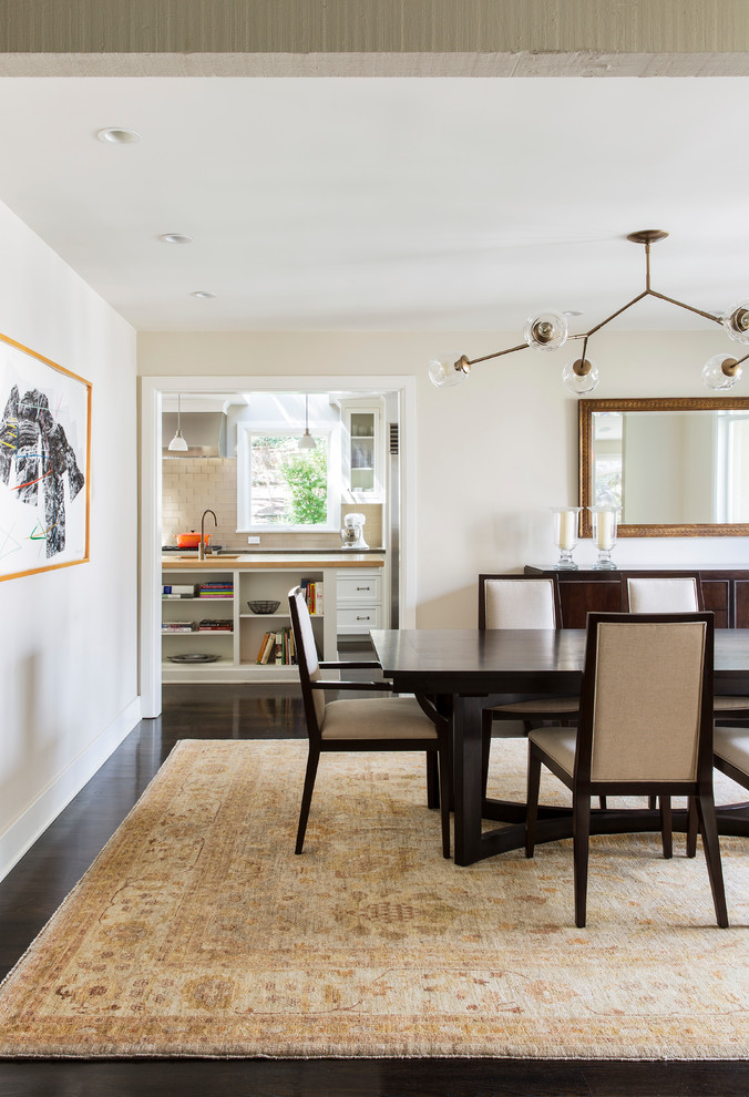 This is an example of a traditional enclosed dining room in Los Angeles with beige walls.