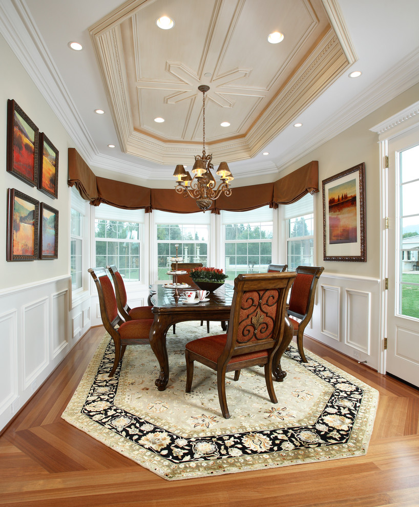 Traditional dining room in San Francisco with beige walls and medium hardwood flooring.