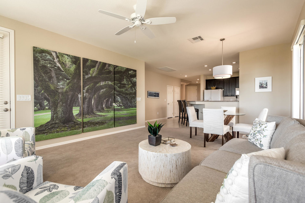 This is an example of a medium sized contemporary open plan dining room in Las Vegas with beige walls, carpet, no fireplace and beige floors.