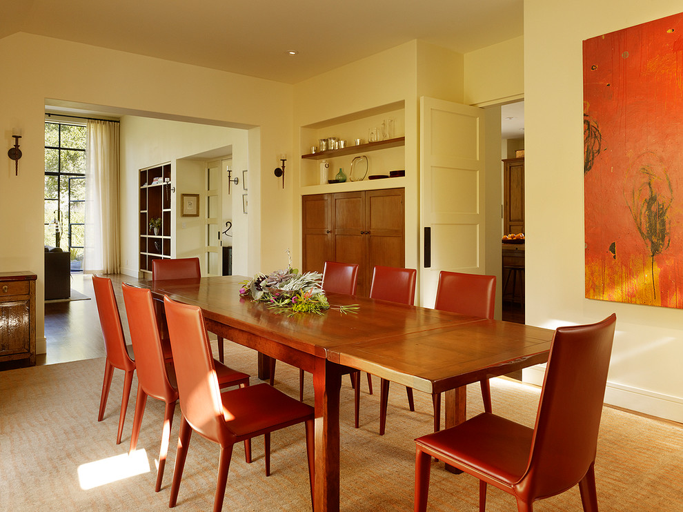 This is an example of a modern dining room in San Francisco with beige walls.