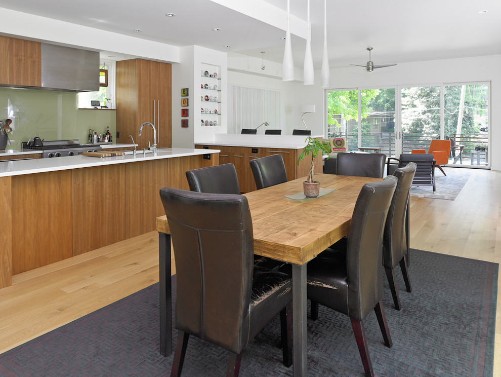 Example of a large minimalist light wood floor kitchen/dining room combo design in Atlanta