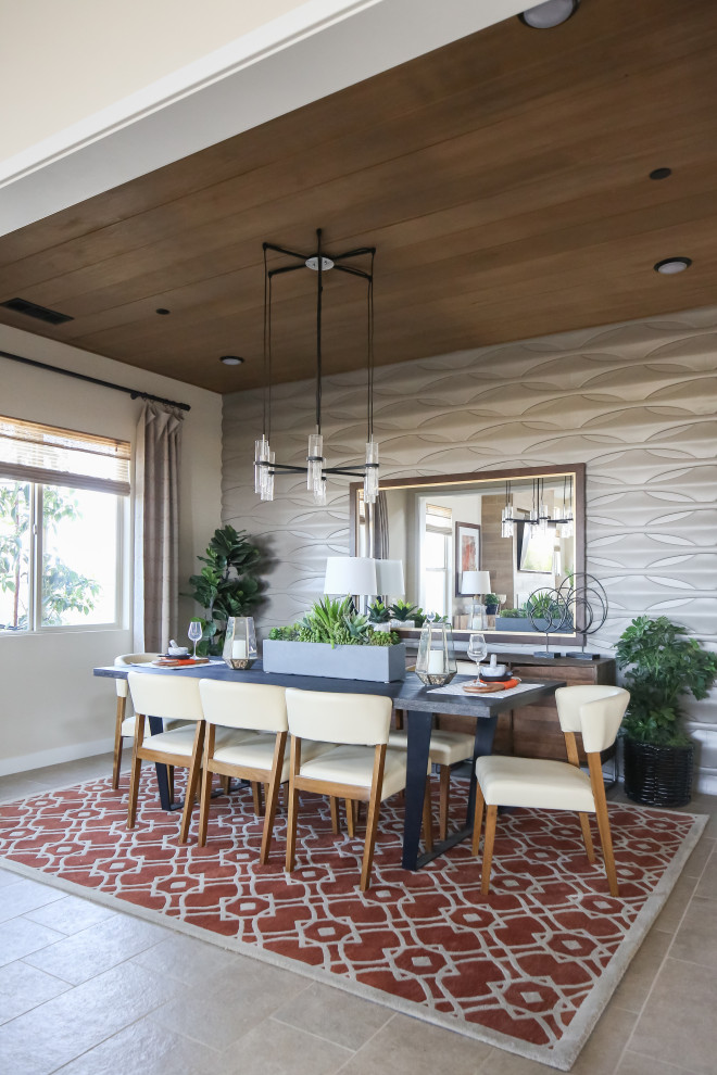 Dining room - contemporary gray floor dining room idea in Orange County with gray walls